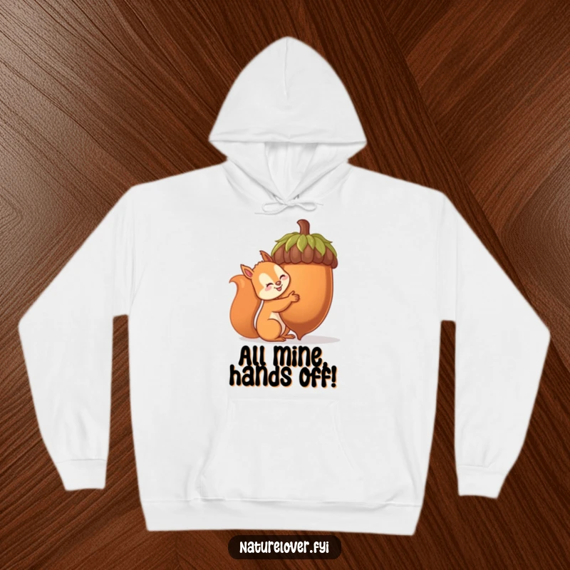 Funny squirrel hoodie depicting a determined squirrel embracing a ridiculously huge acorn, a humorous and cozy apparel choice.