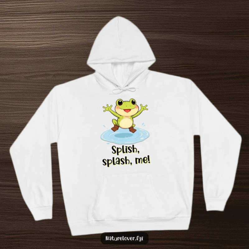 Funny frog hoodie with a delighted frog wearing tiny boots, jumping enthusiastically in a huge puddle, ideal for comfort and humor.